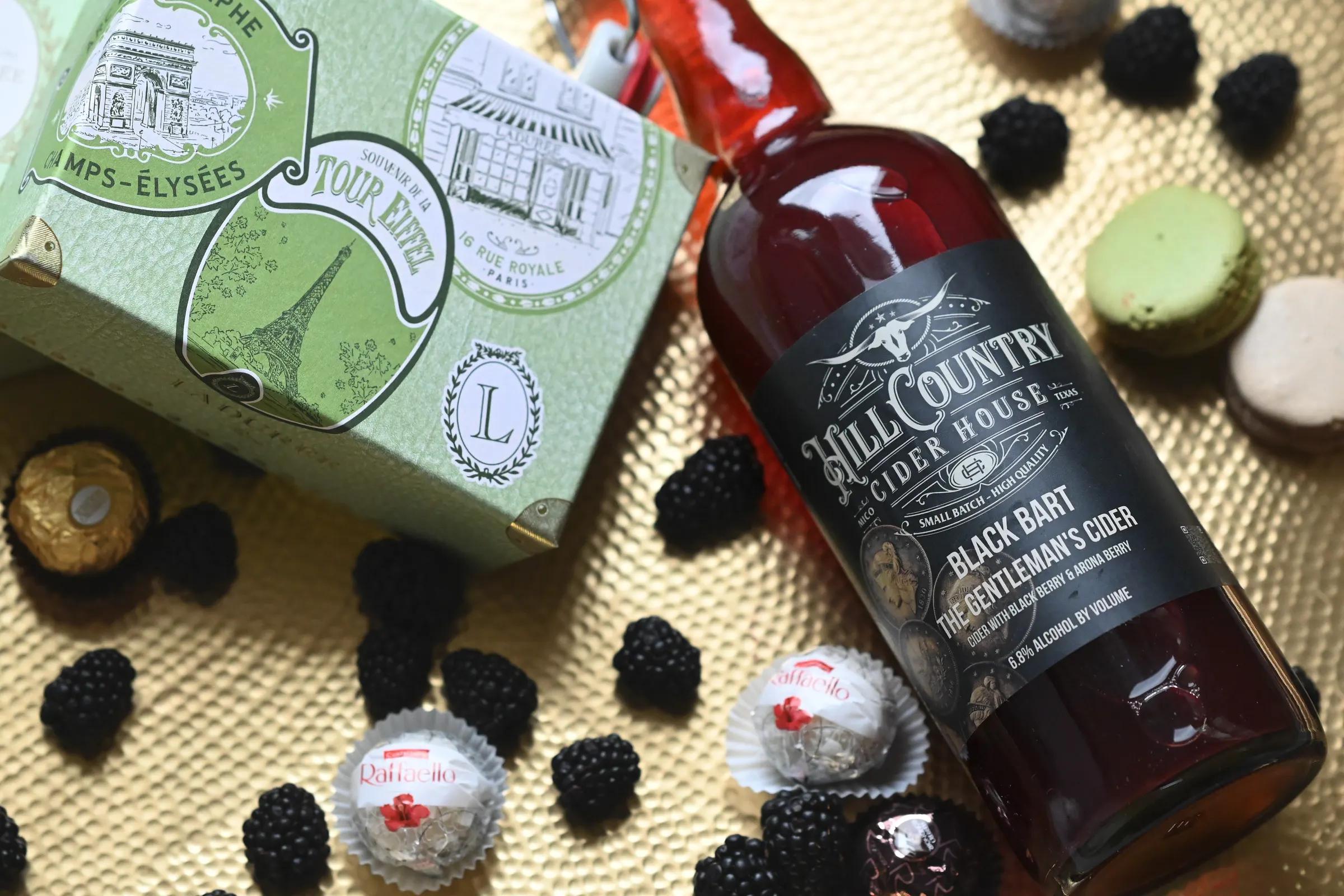 Black Bart cider bottle with blackberries and confections